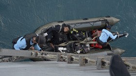 Hujan, Pengangkatan Ekor Pesawat QZ8501 Ditunda