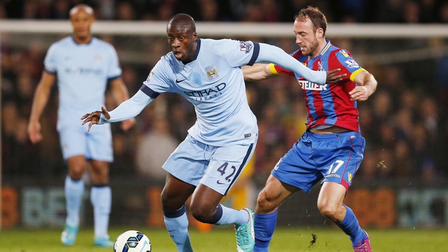 Yaya Toure menegaskan komitmennya bersama Manchester City dan bertekad ingin mengikuti jejak Paolo Maldini di AC Milan.