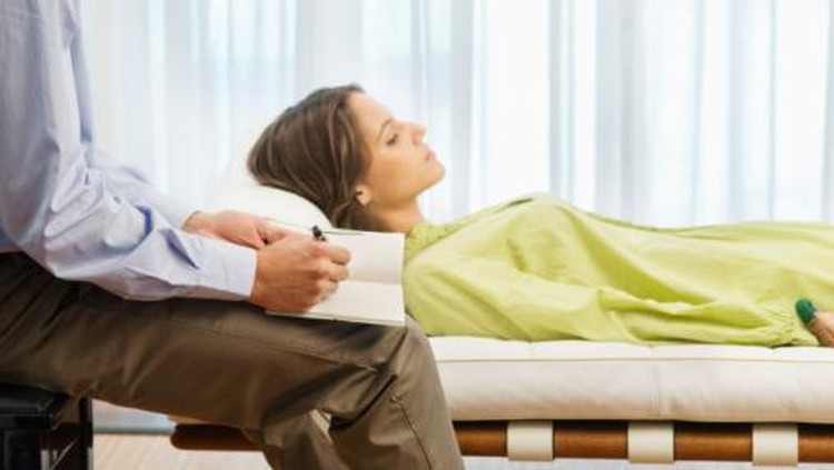 Psychiatrist examining a female patient