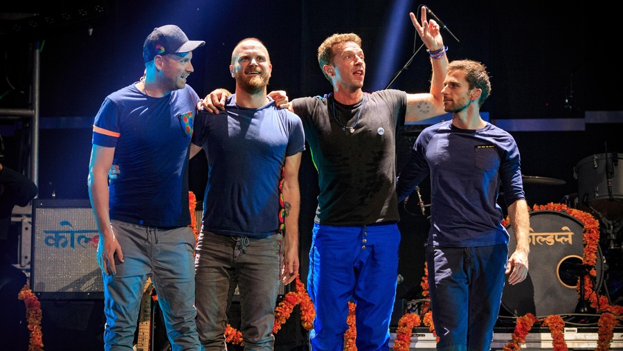 Coldplay (L-R) Guitarist Jonny Buckland, drummer Will Champion, frontman Chris Martin and bassist Guy Berryman of Coldplay take a bow after performing onstage at the 2015 iHeartRadio Music Festival at MGM Grand Garden Arena on September 18, 2015 in Las Vegas, Nevada. (Photo by Christopher Polk/Getty Images for iHeartMedia)