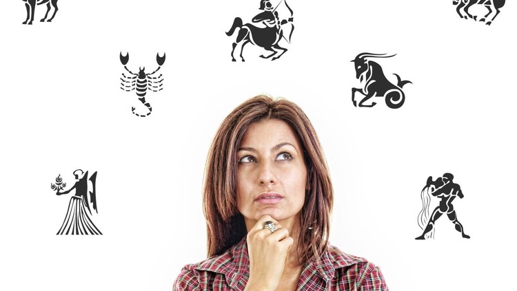 ilustrasi zodiak woman surrounded with zodiac signs thoughtfully looking up with