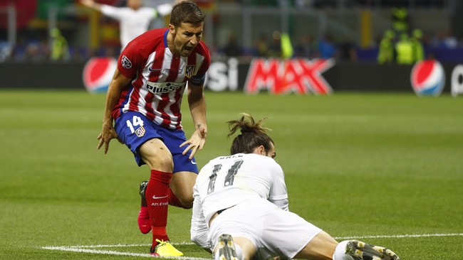 Atletico Madrid dua kali nyaris juara Liga Champions. Menurut gelandang Rojiblancos, Gabi, inilah keindahan sekaligus kekejaman sepak bola.