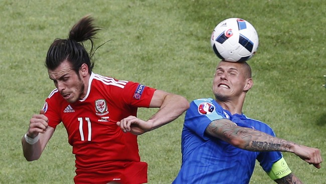 Wales berhasil mengakhiri laga debut mereka di Piala Eropa dengan kemenangan setelah sukses mengandaskan Slovakia dengan skor 2-1.