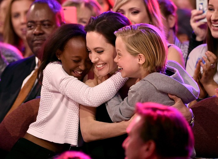 INGLEWOOD, CA - MARCH 28:  Actress Angelina Jolie hugs Zahara Marley Jolie-Pitt (L) and Shiloh Nouvel Jolie-Pitt (R) after winning award for Favorite Villain in 'Maleficent' during Nickelodeon's 28th Annual Kids' Choice Awards held at The Forum on March 28, 2015 in Inglewood, California.  (Photo by Kevin Winter/Getty Images)