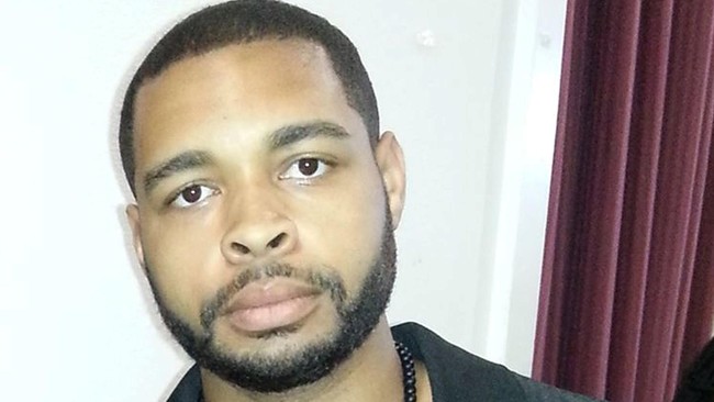 Micah Johnson tertawa dan bernyanyi saat menembaki polisi, dia menulis pesan misterius dengan darah di penghujung nyawanya.