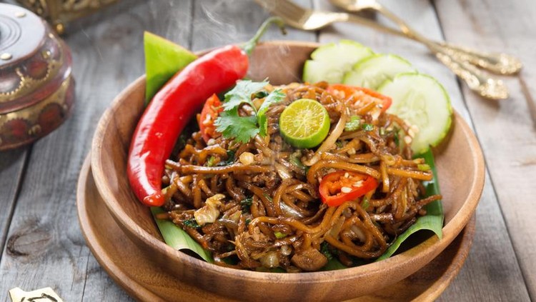 Mee Goreng Mamak Chinese style fried noodle with fish ball on white isolated background