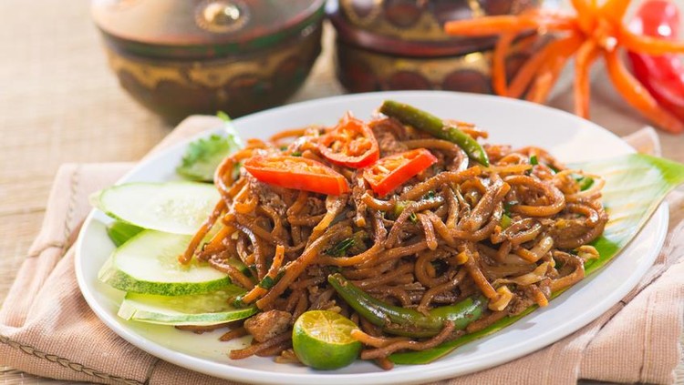 Chinese style fried noodle with fish ball on white isolated background