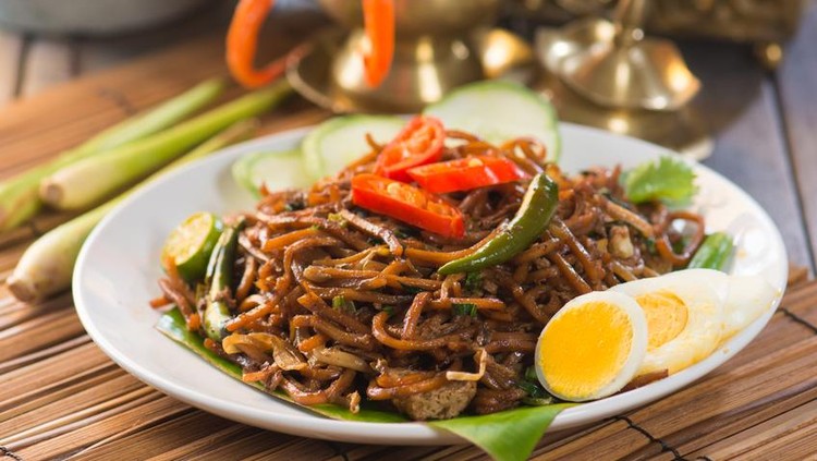 Chinese style fried noodle with fish ball on white isolated background