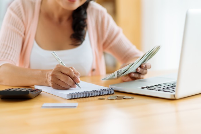 Woman distributing family budget