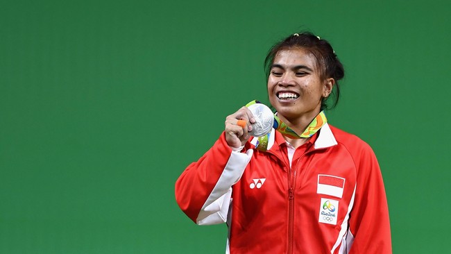 Di usia 22 tahun, Sri Wahyuni telah mencatatkan dirinya dalam lembaran sejarah: atlet yang menyumbangkan perak Olimpiade ke-11 untuk Indonesia.