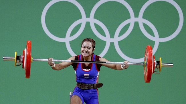 Setelah gagal di Olimpiade 2012, Thailand telah merebut dua emas pada empat hari penyelenggaraan. Ada sosok perempuan penting di balik prestasi itu.