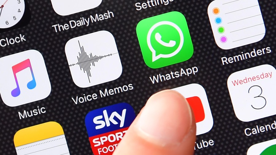 LONDON, ENGLAND - AUGUST 03:  A persons finger is posed next to the Whatsapp app logo on an iPhone on August 3, 2016 in London, England.  (Photo by Carl Court/Getty Images)