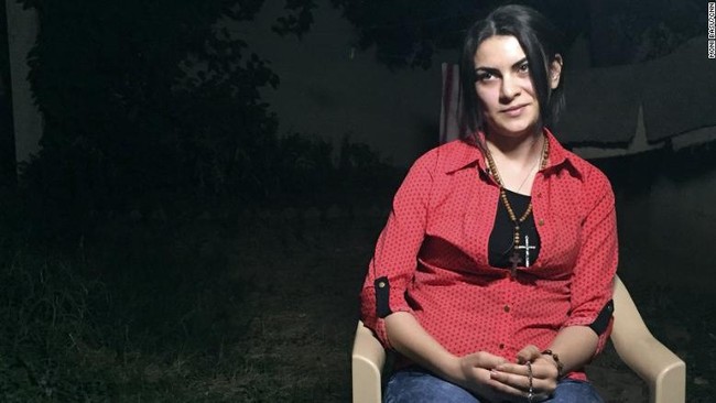Di dalam kamar asrama berukuran kecil, tujuh gadis Kristen yang bersembunyi selama tujuh jam dari militan ISIS yang sempat menduduki kota Kirkuk, Irak.