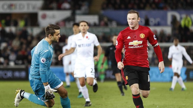Wayne Rooney mencetak rekor baru di Liga Inggris meski dirinya tak mencetak gol untuk kemenangan Manchester United atas Swansea City dengan skor 3-1.