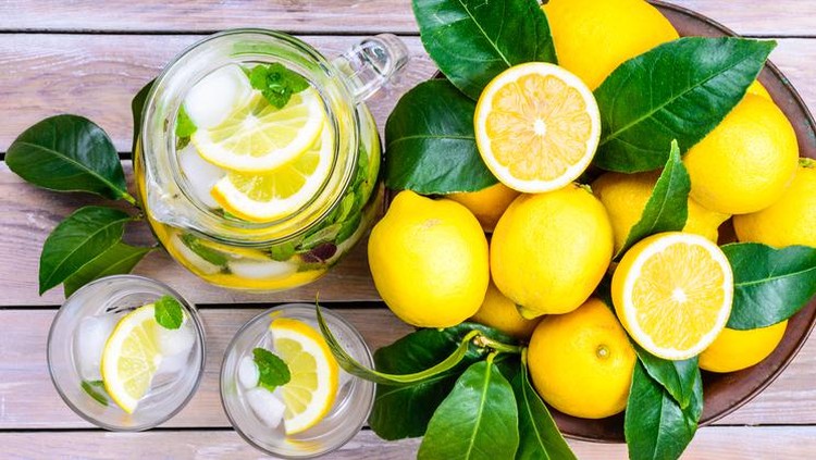 air lemon Lemon infused water with mint in glasses and jug.Healthy drink, detox, dieting beverage.