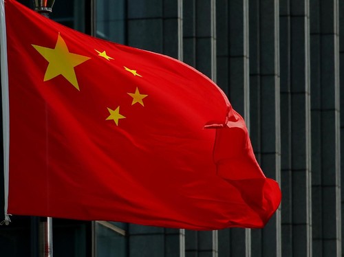 The Chinese national flag is seen on a flagpole in Beijing on August 8, 2016. Most of the five stars on the Chinese flags being used at medal ceremonies at the Rio Olympics are misaligned, officials said, prompting a diplomatic protest and online fur