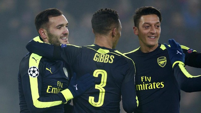 Hattrick Lucas Perez memastikan kemenangan Arsenal 4-1 atas Basel. The Gunners pun lolos ke babak 16 besar Liga Champions dengan status juara grup.