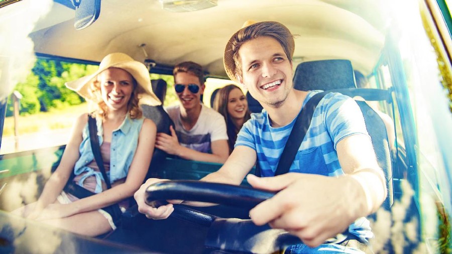 Beautiful young people on a road trip on a summers day