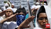 Ribuan 'Pengawal' Rizieq Shihab Ribuan orang menggelar aksi massa di depan Markas Polda Metro Jaya, Jakarta. Mereka menyebut ada aksi kriminalisasi pada Rezieq Shihab.
