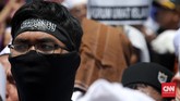 Ribuan 'Pengawal' Rizieq Shihab Ribuan orang menggelar aksi massa di depan Markas Polda Metro Jaya, Jakarta. Mereka menyebut ada aksi kriminalisasi pada Rezieq Shihab.