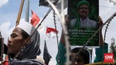 Ribuan 'Pengawal' Rizieq Shihab Ribuan orang menggelar aksi massa di depan Markas Polda Metro Jaya, Jakarta. Mereka menyebut ada aksi kriminalisasi pada Rezieq Shihab.