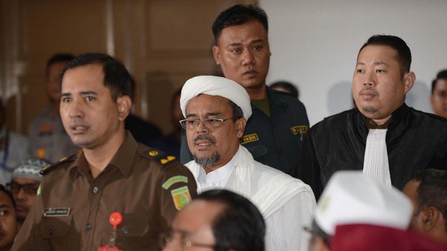 Posisi pasti Rizieq saat ini belum diketahui. Ia diperkirakan berada di Jeddah, Arab Saudi sehingga tak kunjung bisa diperiksa dalam berbagai perkara hukum.