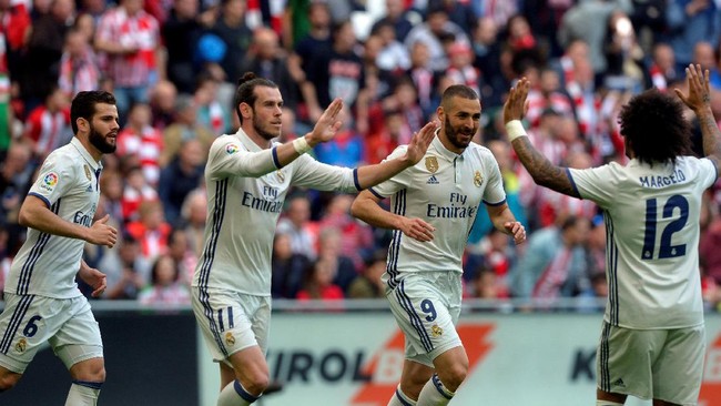 Real Madrid sukses mempertahankan singgasana klasemen sementara La Liga Spanyol usai menundukkan Athletic Bilbao di San Memes, Sabtu (18/3) waktu setempat.
