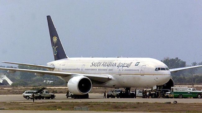 Saudi Arabian Airlines The Saudi Arabian Airlines Boeing 777, hijacked while on a Jeddah-London flight, sits on the tarmac at Baghdad's Saddam International airport before taking off to Riyadh 15 October 2000. The plane left about 24 hours after landing in the Iraqi capital with its 90 passengers and 14 crew aboard. The hijackers, now in the hands of the Iraqi authorities, were both Saudi sergeants who called for an inquiry into human rights abuses in Riyadh and requested political asylum. / AFP PHOTO / KARIM SAHIB