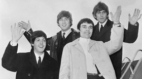 The Beatles, (from L to R) Paul McCartney, John Lennon, Jimmy Nicol and George Harrison, salute as they leave London, in June 1964, as they go on tour in Scandinavia. Ringo Starr, ill, was temporarily replaced for the Denmark and Holland concert date