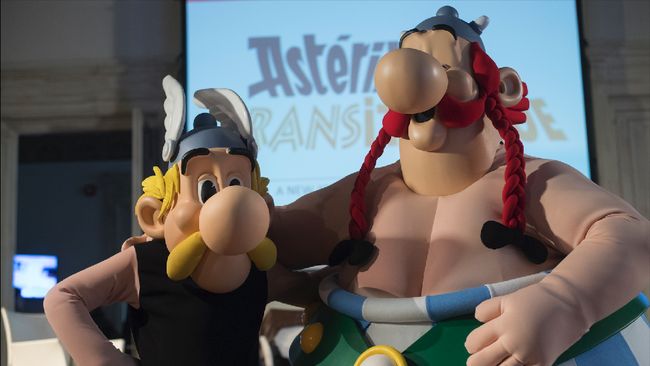 French comics characters Asterix and Obelix (R) pose during a press conference to present 