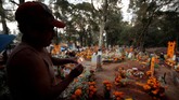 FOTO: Menghargai yang Telah Pergi dalam Hari Orang Mati Day of the Dead atau Hari Orang Mati bagi masyarakat Amerika Tengah bukan cuma perayaan mirip Halloween, namun juga penghormatan kepada Dewa Kematian.