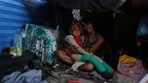 FOTO: Dilema Brasil Mengatasi Tunawisma Tunawisma di Rio de Janeiro menjadi dilema bagi Brasil, meski pemerintah telah membangun penampungan bagi mereka. (REUTERS/Pilar Olivares)