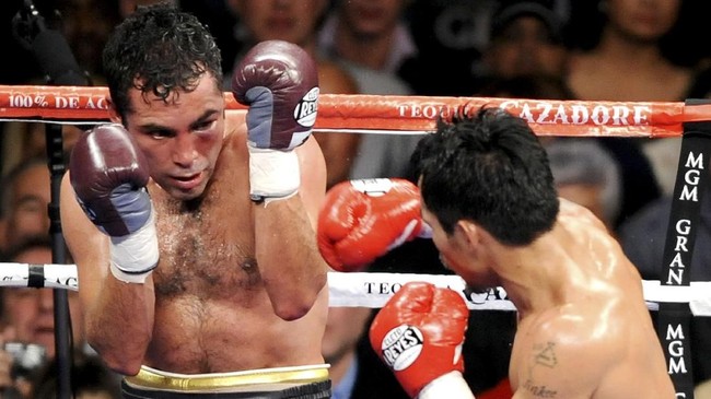 Manny Pacquiao of the Philippines (R) punches Oscar de la Hoya of US during their welterweights showdown at the MGM Grand Garden Arena in Las Vegas, Nevada, on December 6, 2008. Filipino boxing icon Pacquiao stopped Oscar de la Hoya after eight rounds, defying a disadvantage in size with a brutally dominant performance in their welterweight showdown. AFP PHOTO/Jewel SAMAD / AFP PHOTO / JEWEL SAMAD