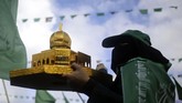 FOTO: Perayaan 30 Tahun Hamas di Tengah Kisruh Yerusalem Hamas Palestina merayakan 30 tahun pendirian gerakan Islamis tersebut di Gaza, sementara situasi memanas karena pengakuan Yerusalem sebagai ibu kota Israel.