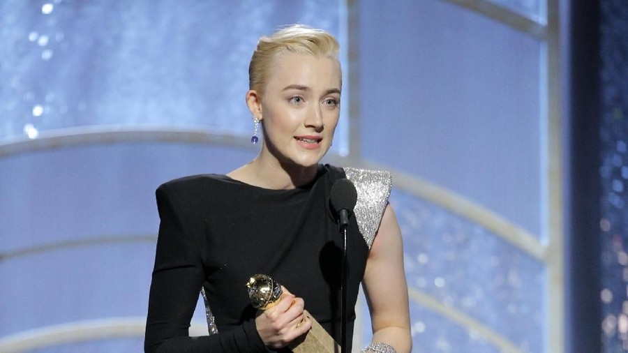 Saoirse Ronan BEVERLY HILLS, CA - JANUARY 07: In this handout photo provided by NBCUniversal, Saoirse Ronan accepts the award for Best Performance by an Actress in a Motion Picture – Musical or Comedy for “Lady Bird” during the 75th Annual Golden Globe Awards at The Beverly Hilton Hotel on January 7, 2018 in Beverly Hills, California. (Photo by Paul Drinkwater/NBCUniversal via Getty Images)