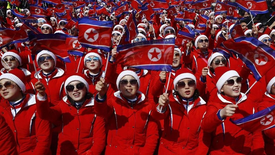 Alpine Skiing - Pyeongchang 2018 Winter Olympics - Men's Giant Slalom - Yongpyong Alpine Centre - Pyeongchang, South Korea - February 18, 2018 - North Korean cheerleaders applaud. REUTERS/Kai Pfaffenbach