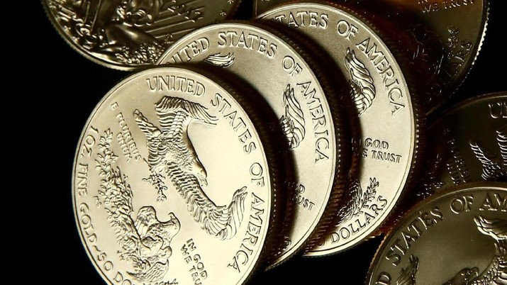 gold u.s. dollar bullion coins FILE PHOTO: Gold U.S. dollar bullion coins are seen in this photo illustration taken in Moscow, Russia, August 4, 2017. REUTERS/Maxim Shemetov - PT Rifan
