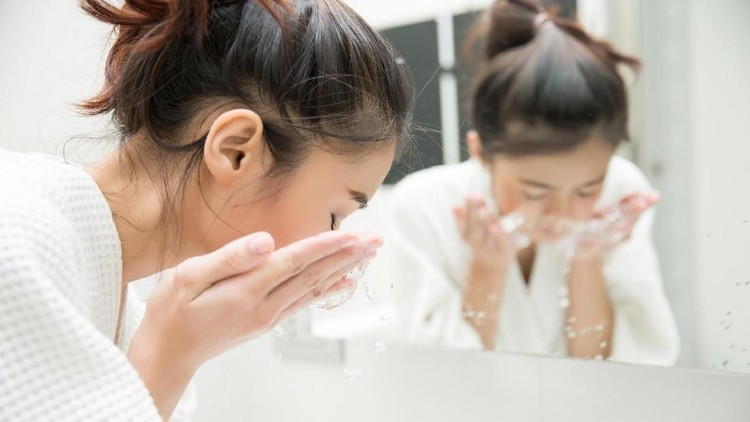 Woman wakes from sleep and she was cleansing the morning before shower