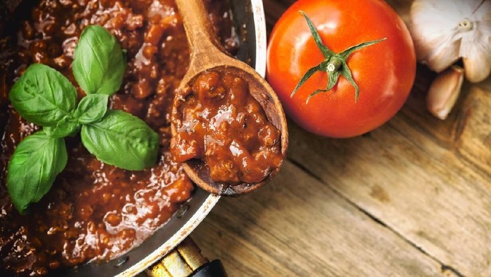 Spaghetti Bolognaise Sauce  in the Pot on the wooden table