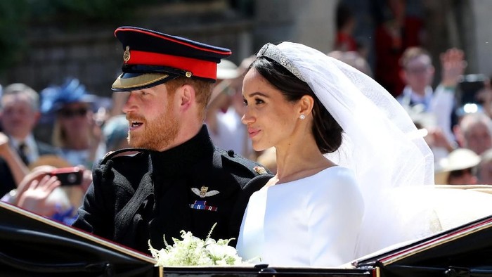 Meghan Markle and Prince Harry leave St George's Chapel at Windsor Castle after their wedding in Windsor, Britain, May 19, 2018. Gareth Fuller/Pool via REUTERS