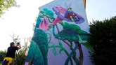 FOTO: 'Berlin Mural Fest 2018' Sulap Ibu Kota Jerman Ajang Berlin Mural Fest 2018 berhasil mempercantik tembok-tembok di ibu kota Jerman dan menarik perhatian para pecinta seni dari seluruh dunia.