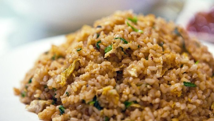 Soy sauce fried rice served in porcelain plate