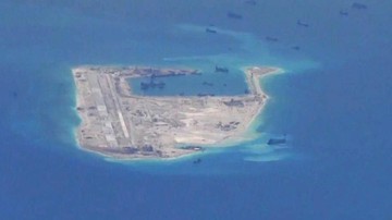 FILE PHOTO: Chinese dredging vessels are purportedly seen in the waters around Fiery Cross Reef in the disputed Spratly Islands in the South China Sea in this still image from video taken by a P-8A Poseidon surveillance aircraft provided by the United States Navy May 21, 2015. U.S. Navy/Handout via Reuters/File Photo ATTENTION EDITORS - THIS PICTURE WAS PROVIDED BY A THIRD PARTY. EDITORIAL USE ONLY