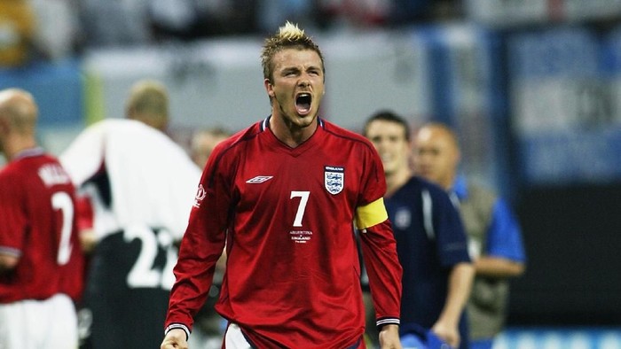 SAPPORO - JUNE 7:  David Beckham of England celebrates after the Group F match against Argentina of the World Cup Group Stage played at the Sapporo Dome in Sapporo, Japan on June 7, 2002.  England won the match 1-0. DIGITAL IMAGE.  (Photo by Laurence Griffiths/Getty Images)
