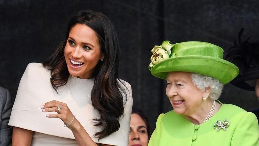 RUNCORN, CHESHIRE, ENGLAND - JUNE 14:  Queen Elizabeth II is greeted with Meghan, Duchess of Sussex as they arrive by Royal Train at Runcorn Station to open the new Mersey Gateway Bridge on June 14, 2018 in the town of Runcorn, Cheshire, England. Meghan Markle married Prince Harry last month to become The Duchess of Sussex and this is her first engagement with the Queen. During the visit the pair will open a road bridge in Widnes and visit The Storyhouse and Town Hall in Chester.  (Photo by Peter Byrne - WPA Pool/Getty Images)