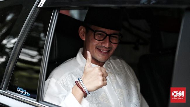 Sandi Ajak Puan 'Kuda-kudaan' Sambil Uji Venue Asian Games Wakil Gubernur DKI Sandiaga Uno mengajak Menteri Puan berkuda bersama sekaligus untuk menguji coba venue pacuan kuda yang akan digunakan di Asian Games 2018.