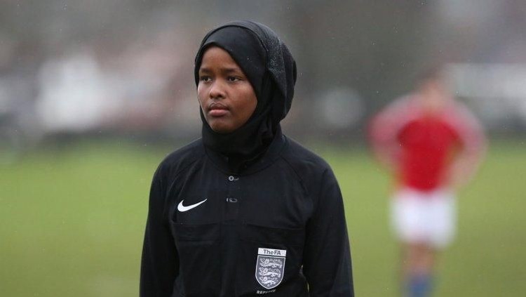 *** EXCLUSIVE - VIDEO AVAILABLE ***

 

 WEMBLEY, UNITED KINGDOM - FEBRUARY 2018: JJ refereeing an all male 11-a-side football match in Wembley, England.

 

 CONDITION OF USAGE: The following must be included in print and/or online: JJ?s story will feature in The History of Football global TV event, airing on History (excluding USA, Canada, Australia, New Zealand), from May 28th-10th June 2018. AS her first full season as a Football Association-registered official draws to a close, Jawahir Roble has made history as the first Muslim female referee in the UK. Having always loved football, JJ made the decision to pursue refereeing more seriously after studying for coaching badges as a teenager. A local girl?s league was short of match officials and JJ stepped in, eventually going on to do a refereeing course. JJ?s love of the beautiful game goes back to her childhood. Among the rubble of the Mogadishu streets, JJ would play football with her friends and siblings. Pleading with her parents to stay out beyond their curfew so she could play football for longer, JJ wasn?t so much oblivious to the dangers of war as conditioned to it. JJ?s incredible story will feature in The History of Football global TV event, airing on History (excluding USA, Canada, Australia, New Zealand), from May 28th-10th June 2018.

 

 PHOTOGRAPH BY Barcroft Images / HISTORYÆ