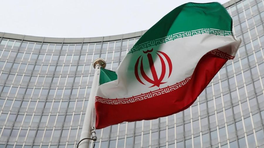 FILE PHOTO: An Iranian flag flutters in front of the International Atomic Energy Agency (IAEA) headquarters in Vienna, Austria, January 15, 2016. REUTERS/Leonhard Foeger/File Photo