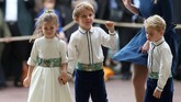 FOTO:Tingkah Gemas George dan Charlotte di Pernikahan Eugenie Pangeran George dan Putri Charlotte menjadi pageboy dan bridesmaid di pernikahan Putri Eugenie. Mereka tampil menggemaskan dan menarik perhatian.