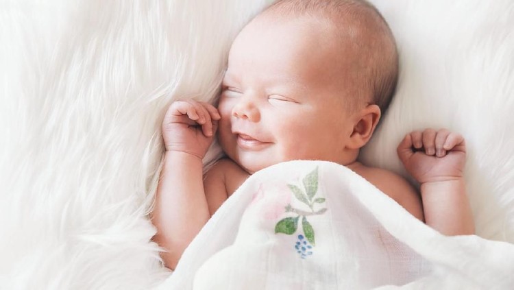 Ilustrasi Bayi Sleeping newborn baby in a wrap on white blanket. Beautiful portrait of little child girl 7 days, one week old.